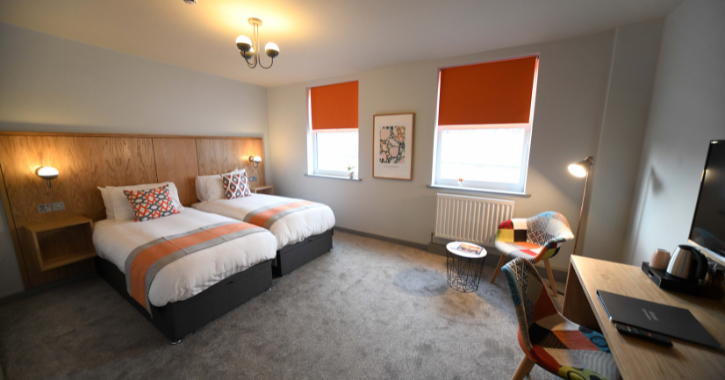 View of a twin bedroom inside Park Head Hotel.